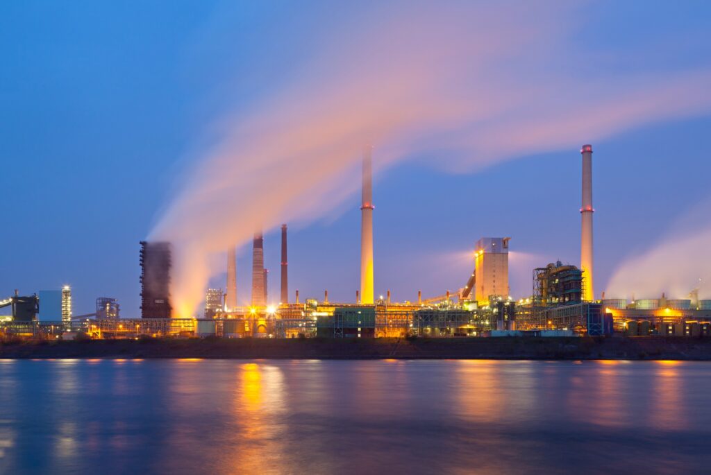 Industry By River At Night